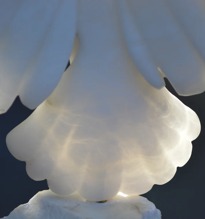 Close up of stone carved bird tail feathers