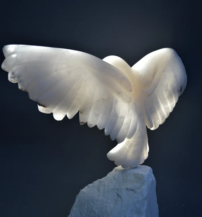 White alabaster stone carving of a bird